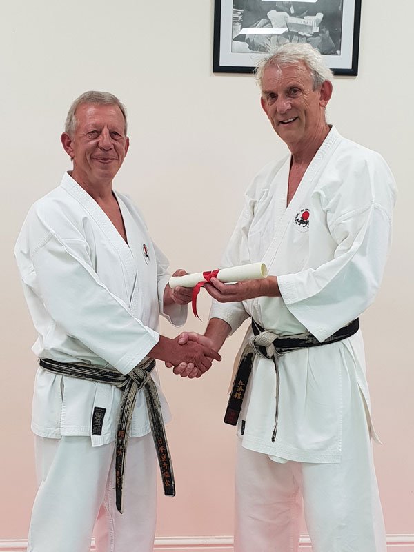 Paul Walton awarded his 5th Dan by Sensei Hazard